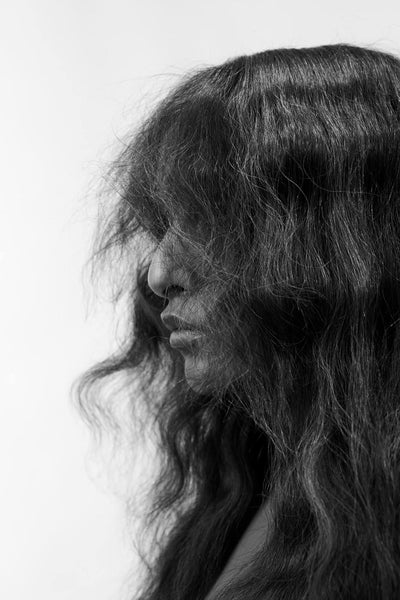 Textured Hair Styling: Woman's Profile with Voluminous Hair using Volume Powder. Black and white.