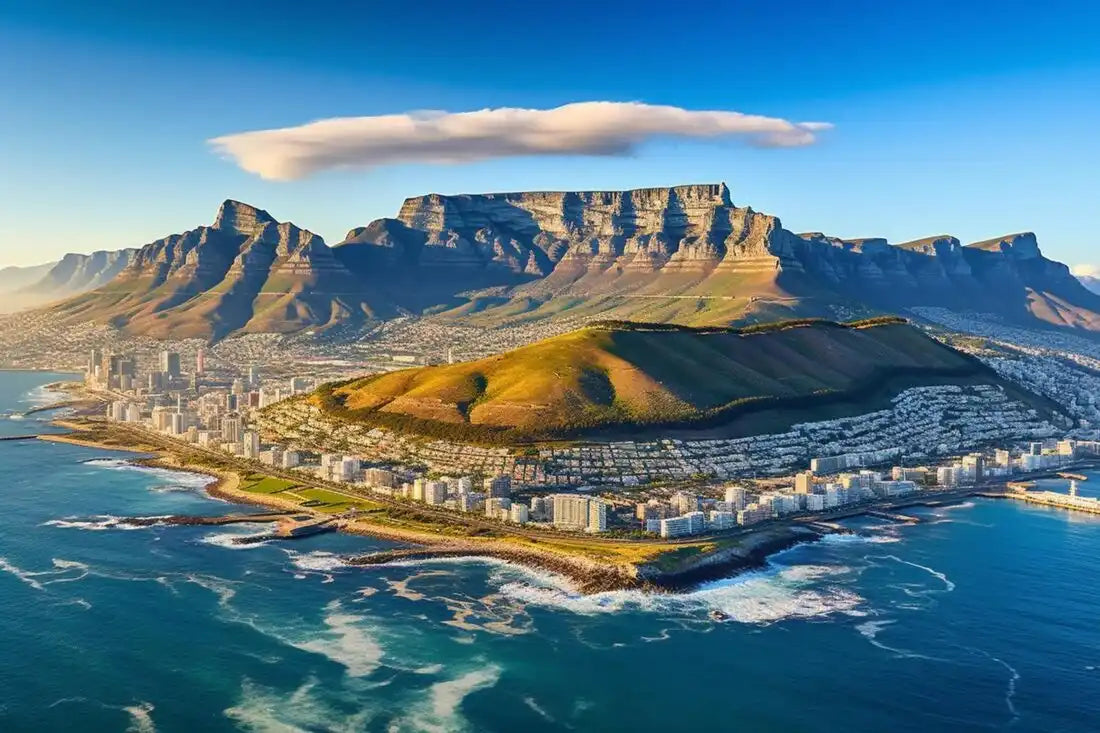 Table Mountain rises dramatically above Cape Town’s coastline and harbor.