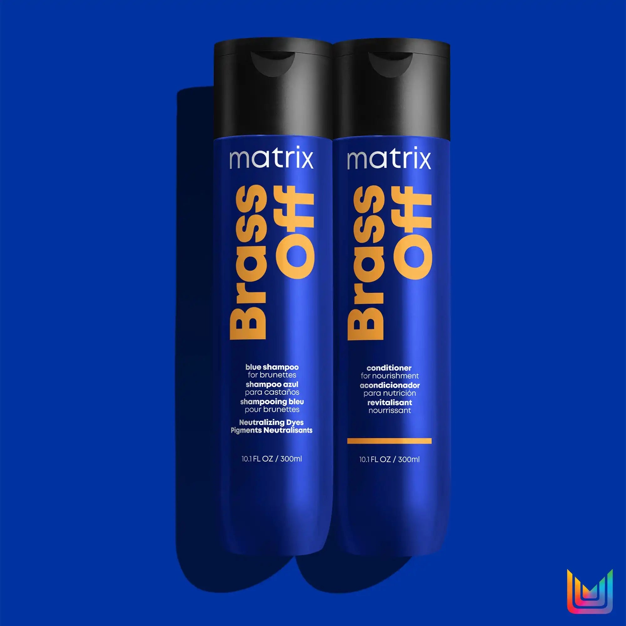 Two blue bottles of Matrix Brass Off hair product.