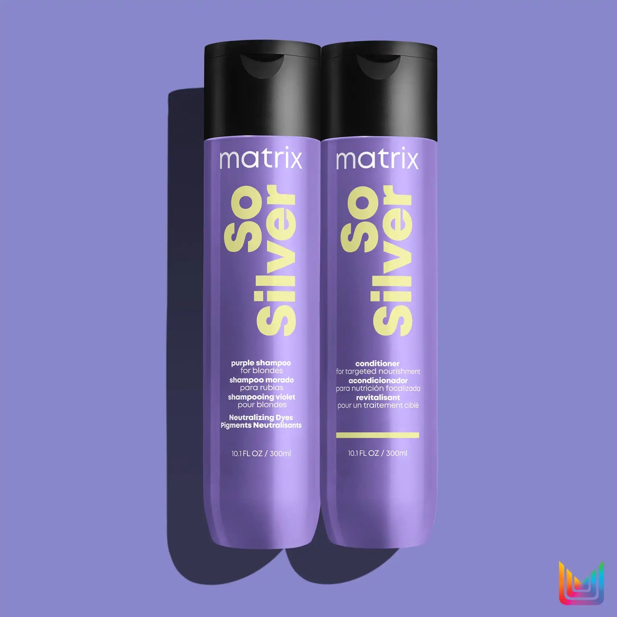 Two purple bottles of Matrix So Silver shampoo.