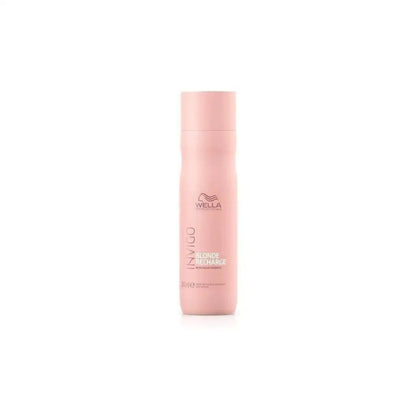 Pink bottle of Wella hair care product.