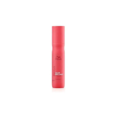 Pink cylindrical bottle of Wella hair product.